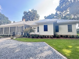 Commercial storefront metal fascia painting in Baldwin County